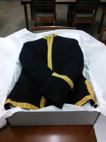 Band uniform with sleeves tucked securely in storage box